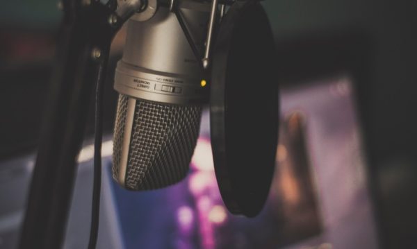 Microphone in front of a monitor.