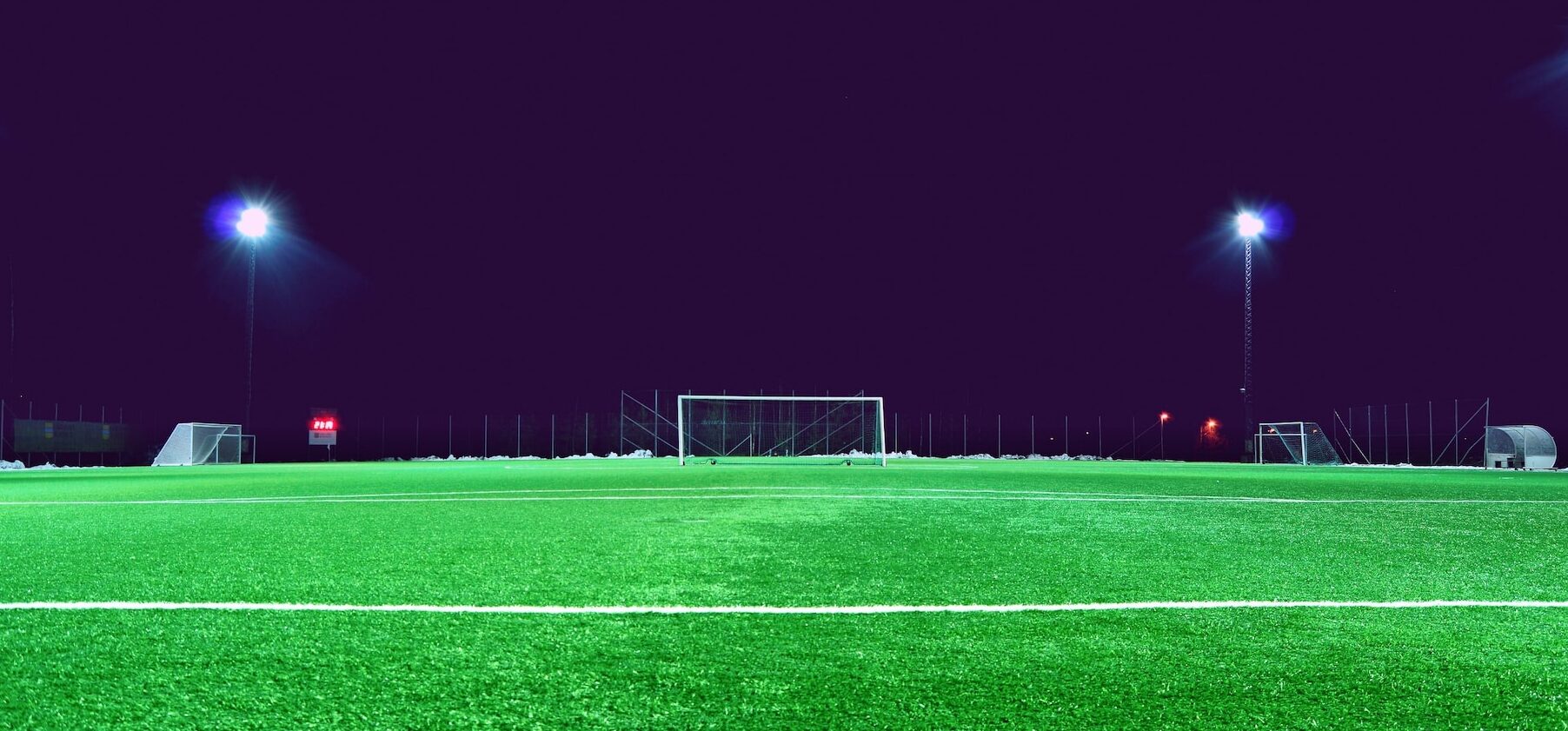 Football pitch at night.