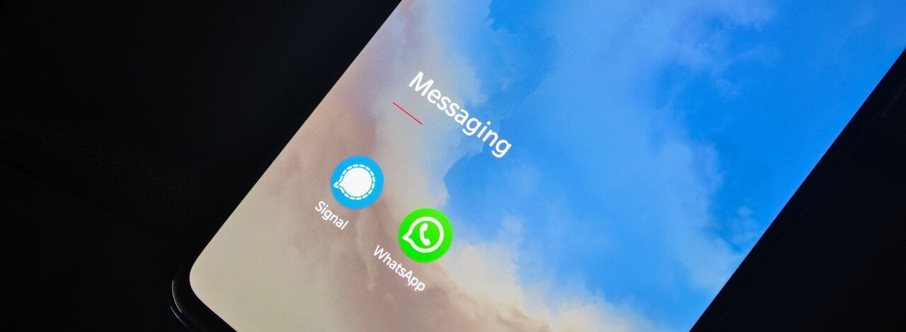 Smartphone screen with Signal and WhatsApps apps under a Messaging heading.